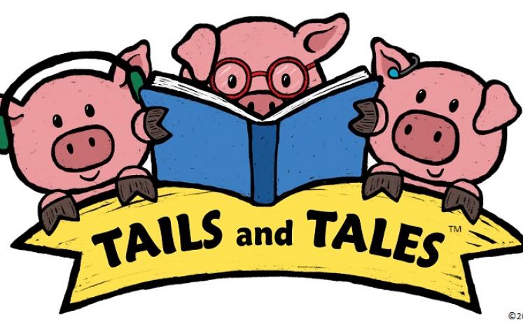 Three cartoon pigs, the center one is reading a book, the other two have headphones or earbuds